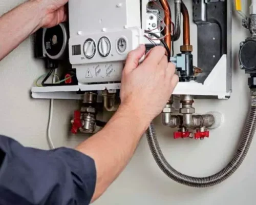 man installing the boiler