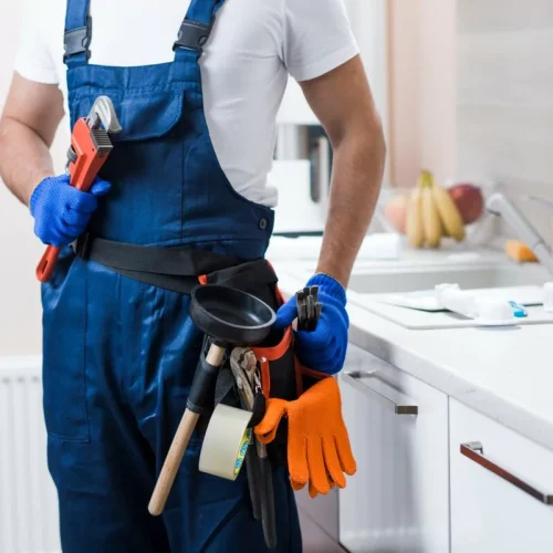 plumber holding tools